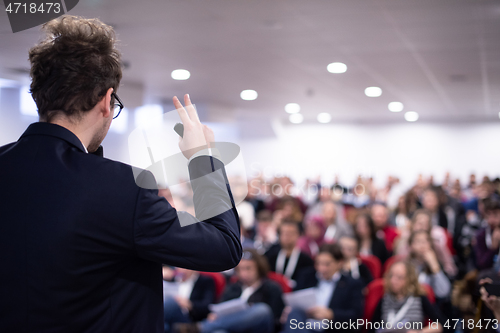 Image of businessman giving presentations at conference room