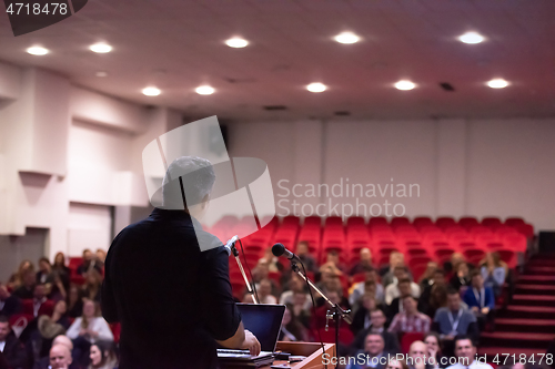 Image of businessman giving presentations at conference room