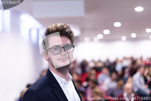 Image of businessman giving presentations at conference room