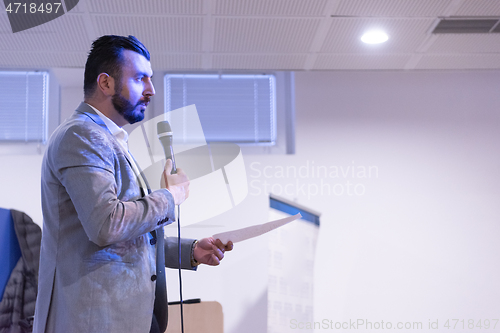 Image of businessman giving presentations at conference room