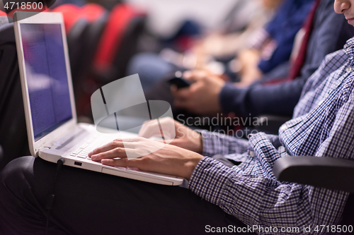 Image of business people hands using laptop computer