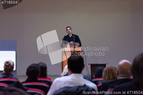 Image of businessman giving presentations at conference room