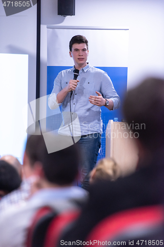 Image of businessman giving presentations at conference room