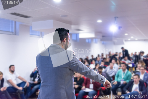 Image of businessman giving presentations at conference room