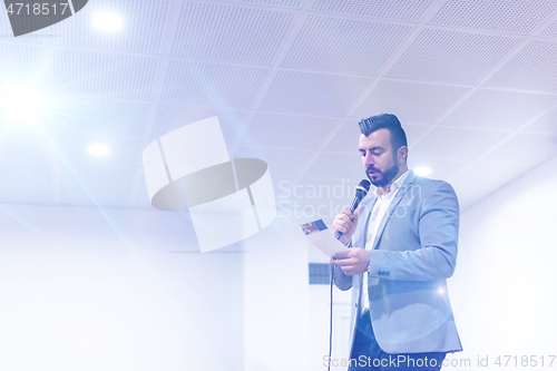 Image of businessman giving presentations at conference room