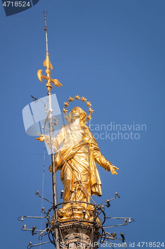 Image of golden Madonna statue at Cathedral Milan Italy