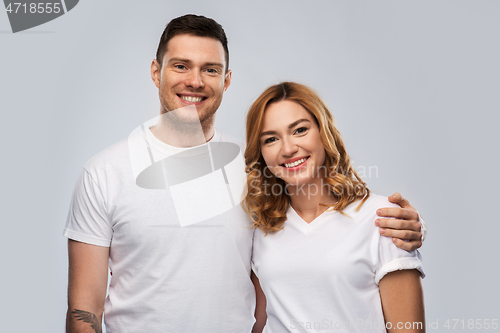 Image of portrait of happy couple in white t-shirts