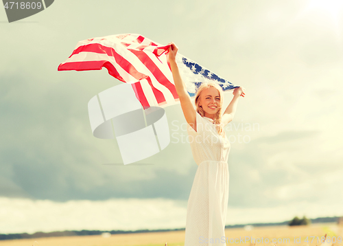 Image of happy woman with american flag on cereal field