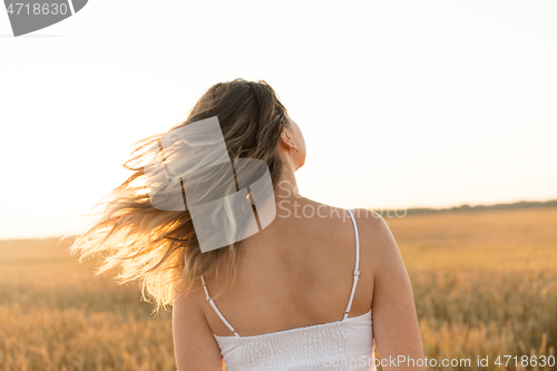 Image of woman on cereal field in summer