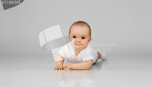 Image of sweet little baby lying on floor