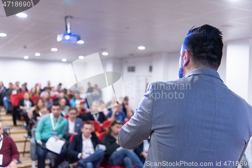 Image of businessman giving presentations at conference room