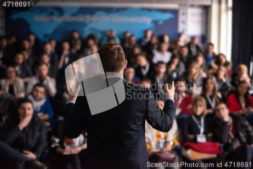 Image of businessman giving presentations at conference room