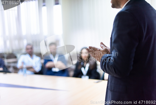 Image of businessman giving presentations at conference room