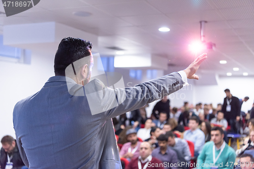 Image of businessman giving presentations at conference room