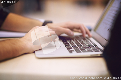 Image of business people hands using laptop computer