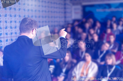 Image of businessman giving presentations at conference room