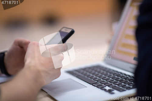 Image of business people hands using smart phone