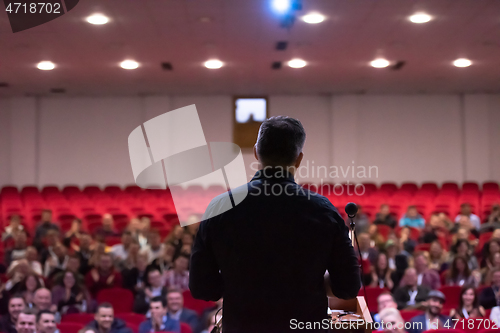 Image of businessman giving presentations at conference room