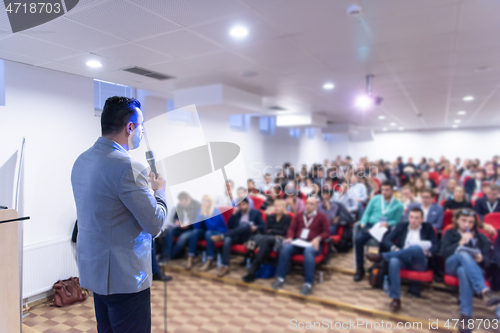 Image of businessman giving presentations at conference room