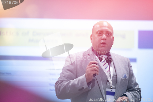 Image of businessman giving presentations at conference room