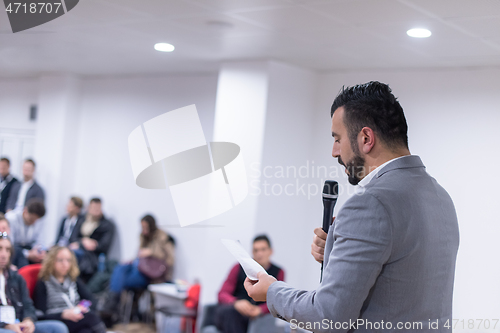 Image of businessman giving presentations at conference room