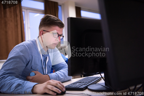 Image of businessman working using a computer in startup office