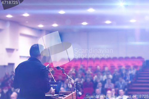 Image of businessman giving presentations at conference room