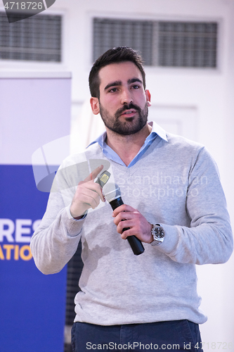 Image of businessman giving presentations at conference room