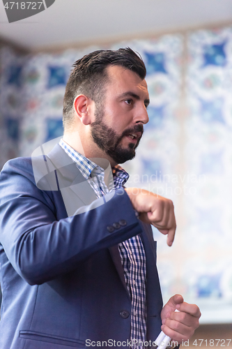 Image of businessman giving presentations at conference room