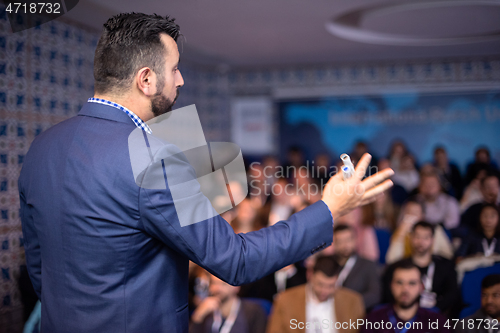 Image of businessman giving presentations at conference room