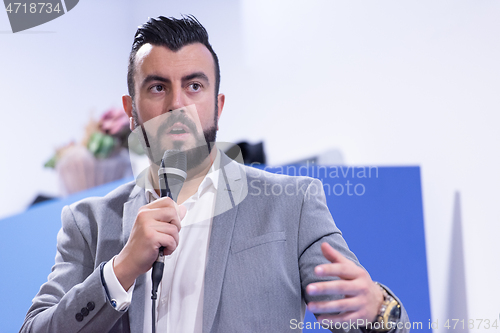 Image of businessman giving presentations at conference room