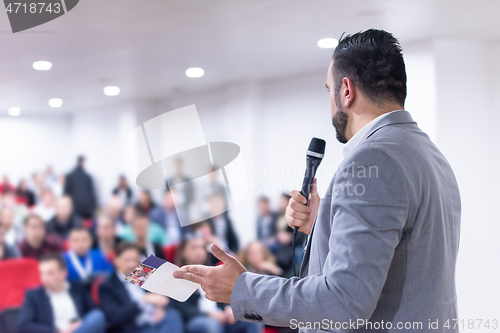 Image of businessman giving presentations at conference room