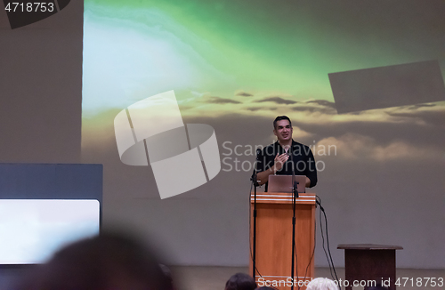 Image of businessman giving presentations at conference room