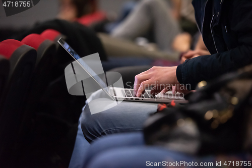 Image of business people hands using laptop computer