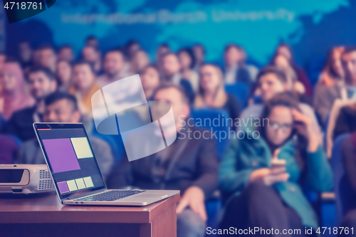 Image of laptop computer at podium