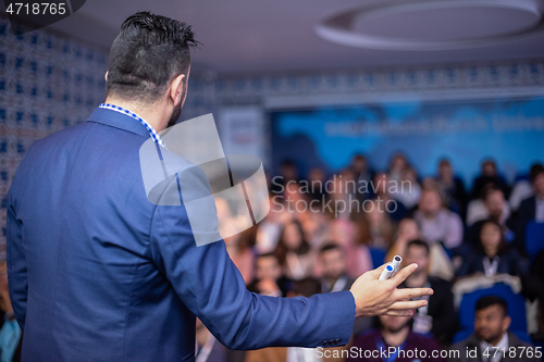 Image of businessman giving presentations at conference room