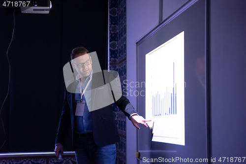 Image of businessman giving presentations at conference room