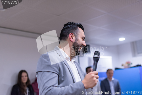 Image of businessman giving presentations at conference room