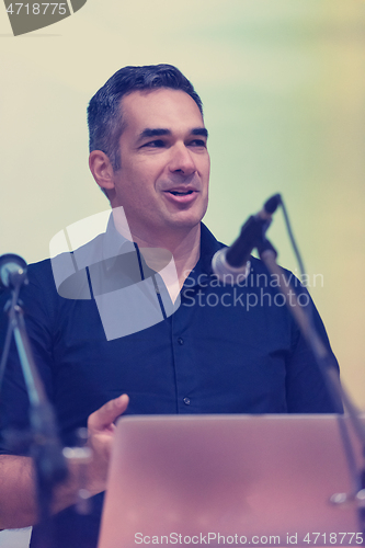 Image of businessman giving presentations at conference room