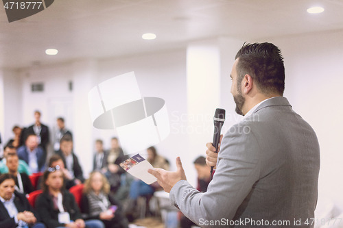 Image of businessman giving presentations at conference room