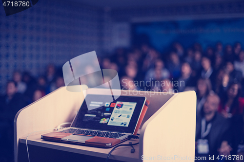 Image of laptop computer at podium