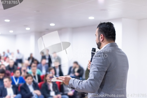 Image of businessman giving presentations at conference room