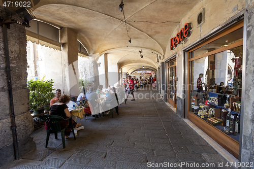 Image of Tourists in sidewalk cafes in Genoa, Italy