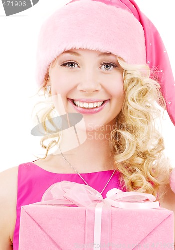 Image of cheerful santa helper girl with gift box