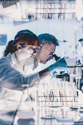 Image of Health care researchers working in scientific laboratory.