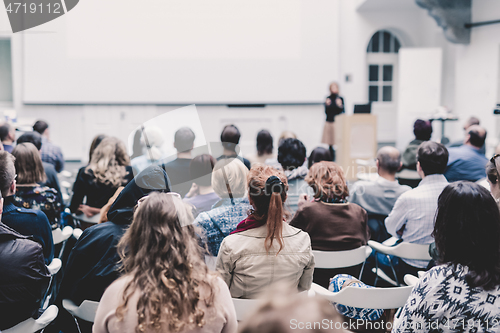 Image of Woman giving presentation on business conference.