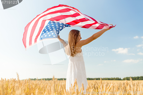 Image of girl with american flag waving over cereal field