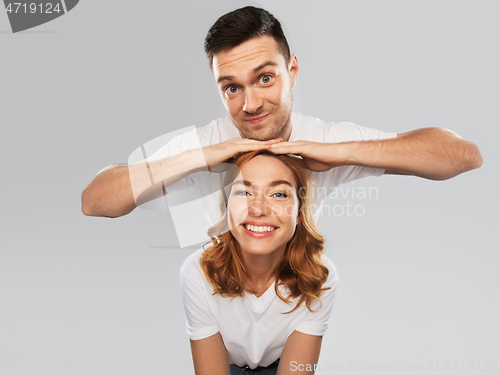 Image of portrait of happy couple in white t-shirts