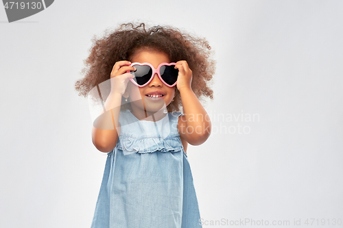 Image of little african girl in heart shaped sunglasses