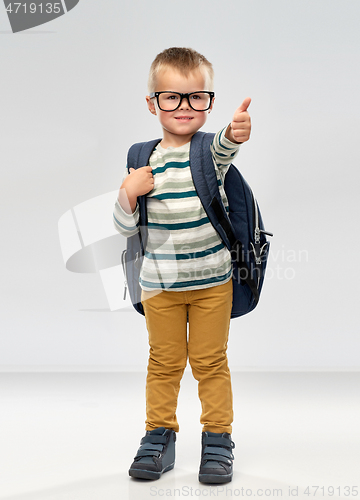 Image of portrait of smiling boy with school backpack